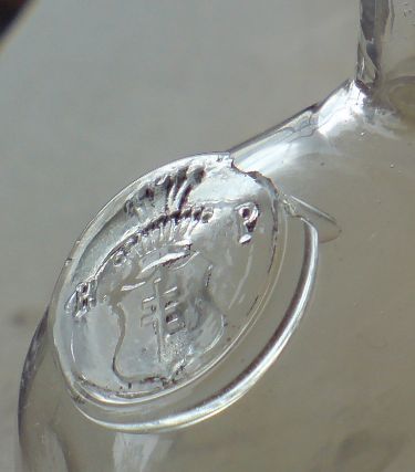 Roman Potocki's seal on the shoulder of a vodka flask